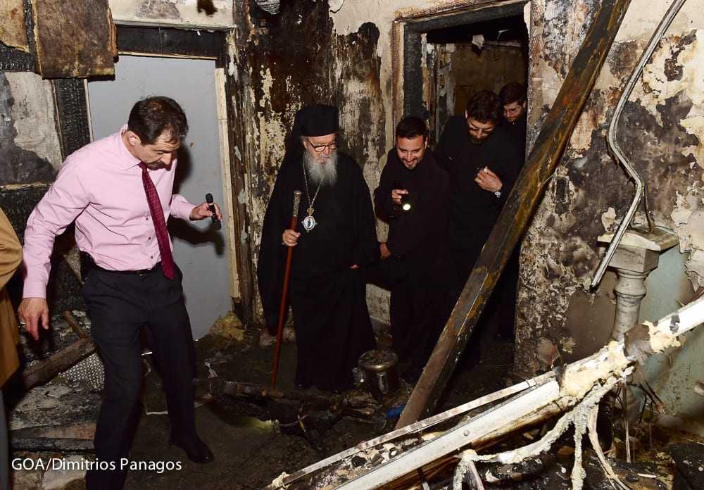 Archbishop Demetrios at the fire-ravaged Greek Orthodox Church of the Transfiguration of Christ in Corona, NY.